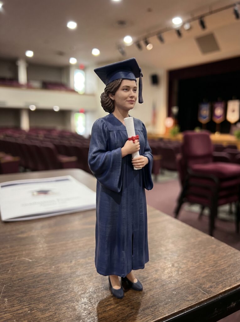 custom 3D graduation figurine holding diploma reflective resin keepsake