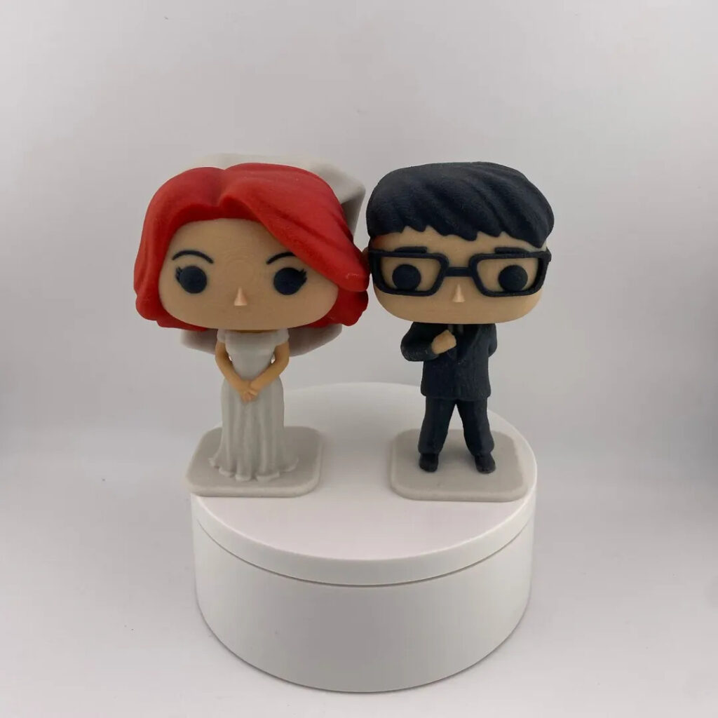 Stylized keepsake figurine of a couple inspired by photographs and designed as a personalized gift to remember.
