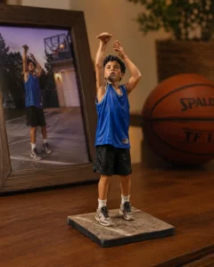 A realistic custom 3D figurine recreated from a child’s basketball photo, turned into a personalized keepsake figurine and meaningful memory gift for sports-loving families.